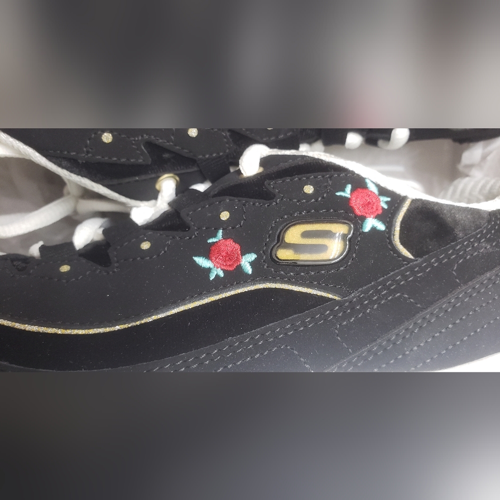 Sketchers black tennis shoes with rose design size 8.5. Rate find New with box